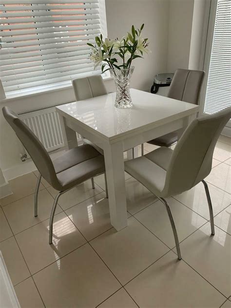 Next white extending dinning table with 4 chairs | in Laindon, Essex | Gumtree