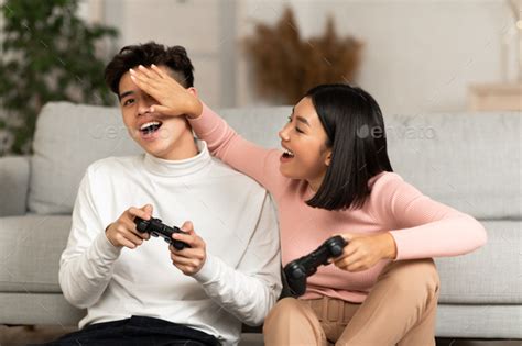 Happy Korean Boyfriend And Girlfriend Playing Video Games At Home Stock ...