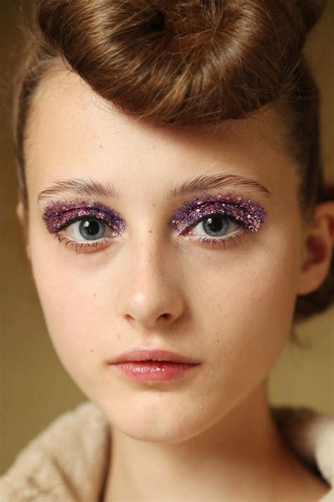 Glitter eyeshadow in a variety of hues was applied liberally to the models' lids at Undercover ...