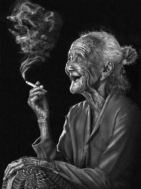 Interesting photo of an old lady smoking ... it's beautiful in a way ...