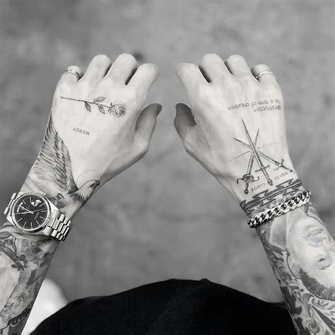 Rose and swords by Dragon Ink tattooed on both hands | Hand tattoos for guys, Small hand tattoos ...