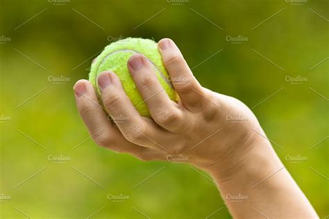 woman hand holding tennis ball | High-Quality Sports Stock Photos ~ Creative Market