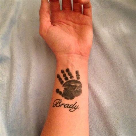 Unique Handprint Tattoo Ideas | Baby hand tattoo, Hand print tattoos ...