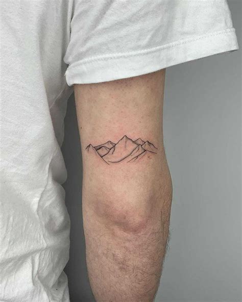 Minimalist mountains tattooed on the right arm by Conz Thomas | Simple ...