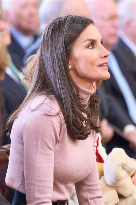 Queen Letizia wore a Boss sweater and Belt with a Reiss skirt, White gold diamond studs, a ...