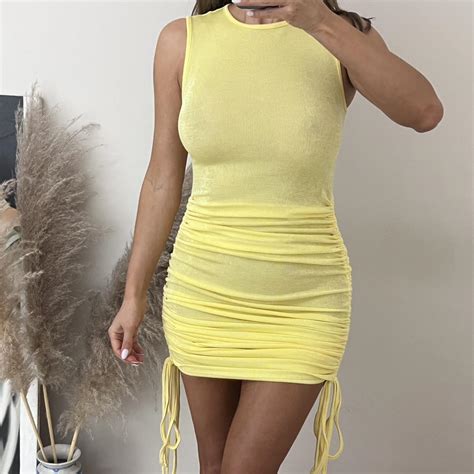 Lemon yellow mini dress. High neck tank style with... - Depop