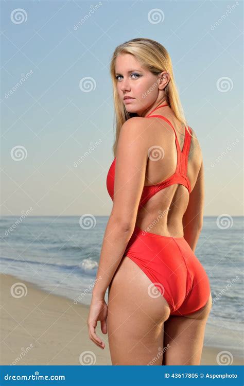 Female Lifeguard On Beach Stock Image | CartoonDealer.com #43617805