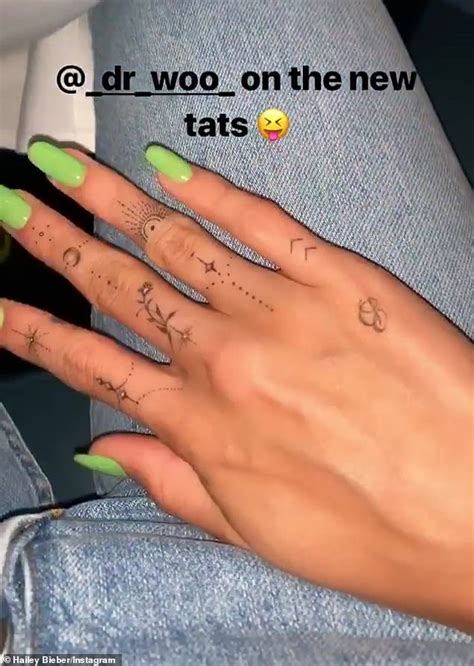 Hailey Baldwin shows off intricate new finger tattoos and cursive inking on her neck | Daily ...