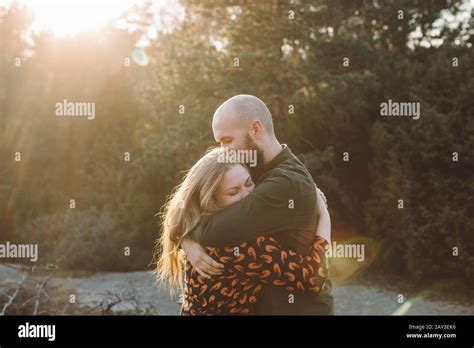 Couple hugging together Stock Photo - Alamy