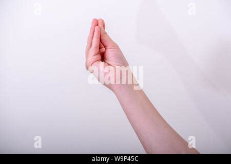 Woman gesturing typical Italian hand gesture, this gesture meaning ""what are you talking about ...