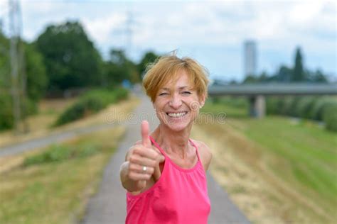 Enthusiastic Woman Giving a Thumbs Up Gesture Stock Photo - Image of enthusiastic, gesture ...