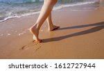Free Image of Close Up of Bare Feet on Sandy Beach | Freebie.Photography