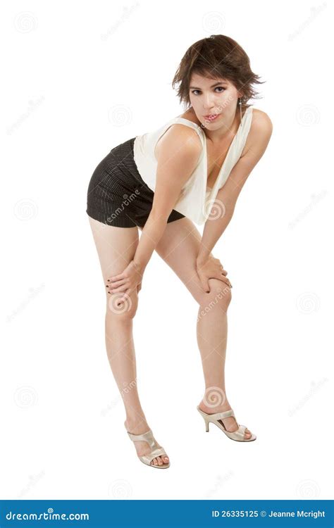 Glamorous Young Woman Stands with Hands on Knees. Stock Image - Image of fashion, high: 26335125