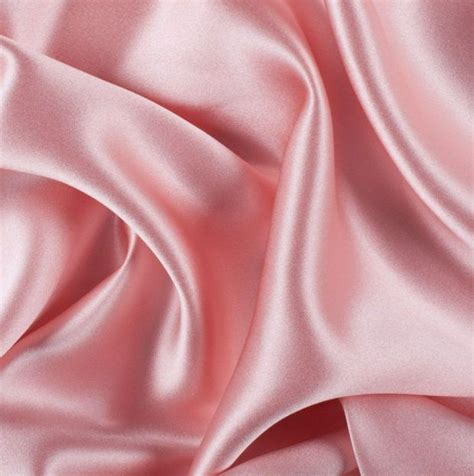 a close up view of a pink satin fabric