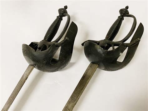 PAIR OF TOLEDO STEEL SWORDS - Southgate Auction Rooms