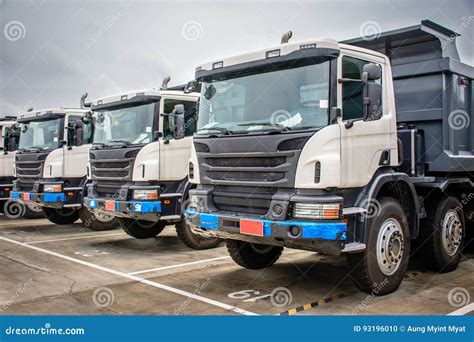 Photo of Brand New Dump Trucks, To Use in Construction Site Editorial ...