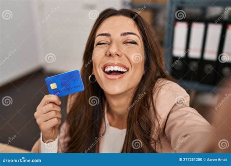 Young Brunette Woman Working at Small Business Ecommerce Holding Credit Card Smiling and ...