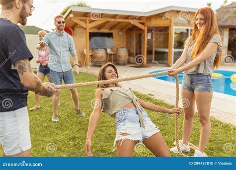 Friends Participating in Limbo Dance Contest Stock Photo - Image of five, carefree: 209487810