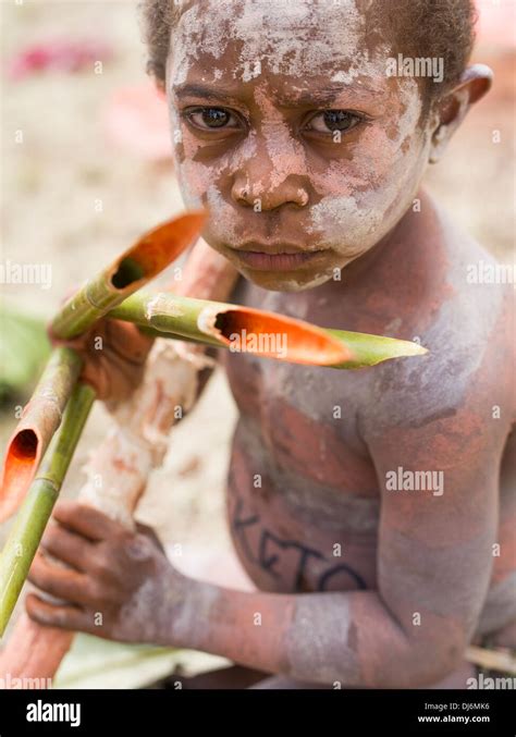 Young boy with bamboo fingers hi-res stock photography and images - Alamy