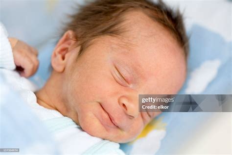 Newborn Smiling In Sleep High-Res Stock Photo - Getty Images