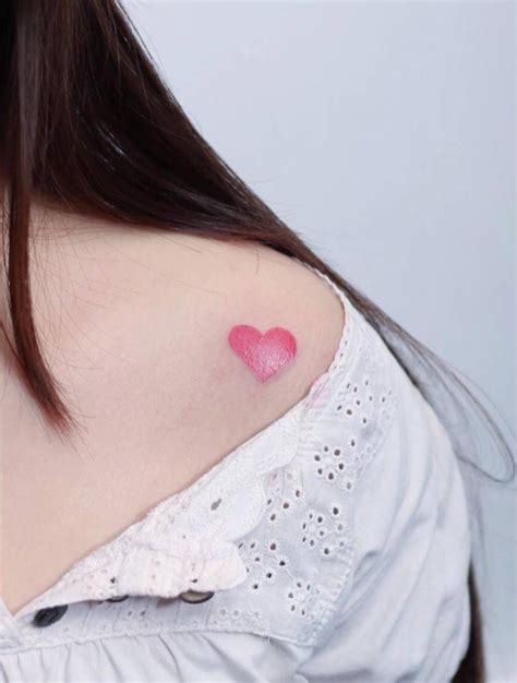 Small pink heart tattoo on the left shoulder | Small heart tattoos ...