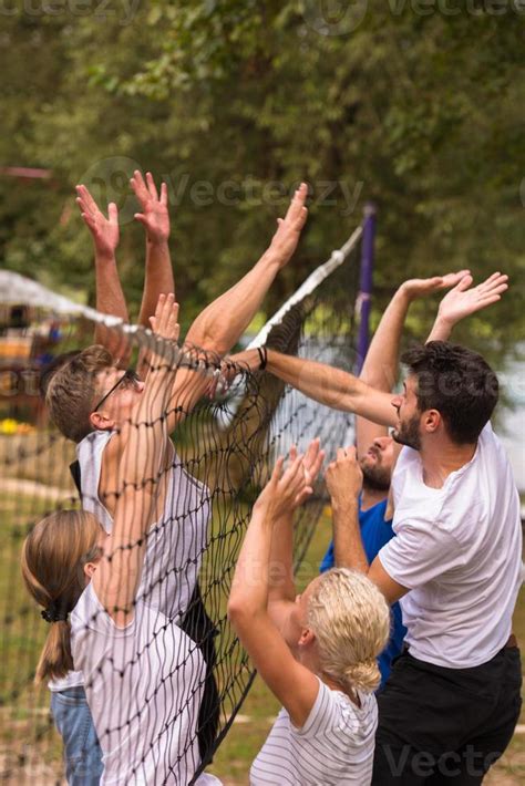 group of young friends playing Beach volleyball 10708393 Stock Photo at Vecteezy