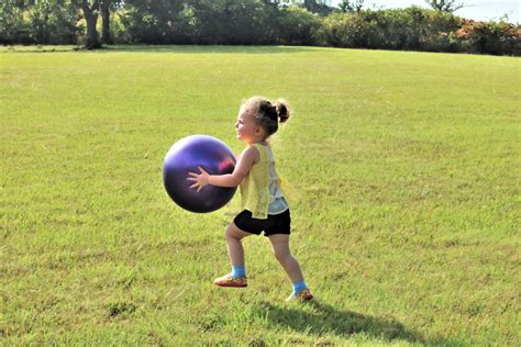 Little Girl Running With Big Ball Free Stock Photo - Public Domain Pictures