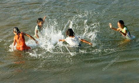 Asian children bath on Vietnamese river – Stock Editorial Photo © xuanhuongho #55463127