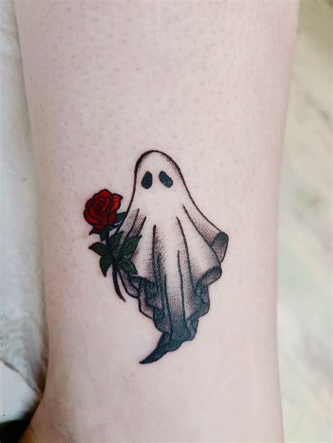 a ghost with a rose tattoo on the ankle