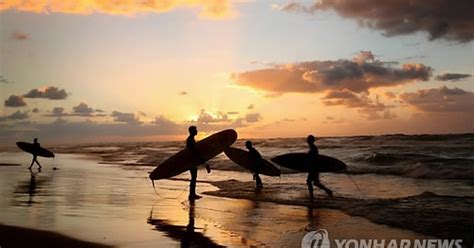 MIDEAST PALESTINIANS GAZA SUNSET SURFING