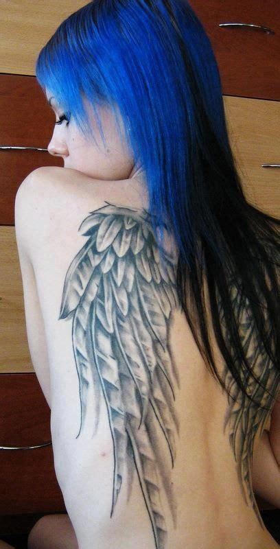 Blue hair girl’s wings tattoo