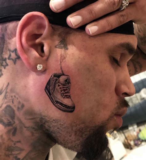 Chris Brown Really Got an Air Jordan Tattooed on His Face | Complex