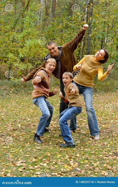 Portrait of Family of Four in Park Stock Photo - Image of female, mushrooms: 148325718