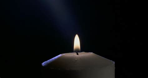 Candle blown out with smoke rising from wick Stock Video Footage - Storyblocks