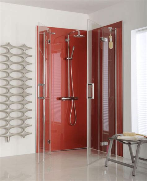 a bathroom with a red shower stall and white tile flooring next to a window