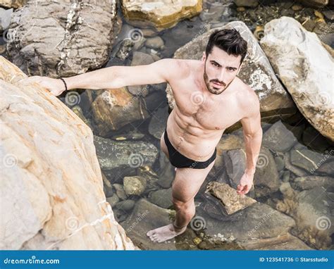 Young Man Standing on a Beach Alone Stock Photo - Image of macho, muscular: 123541736