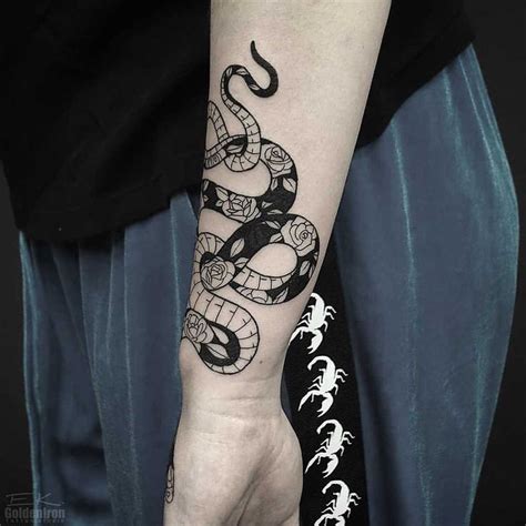 Floral black and white snake tattoo inked on the left forearm | Tattoos ...