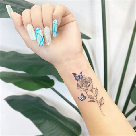 Rose&Butterflies Tattoo🌹💙🦋 | Rose tattoos on wrist, Butterfly tattoos ...