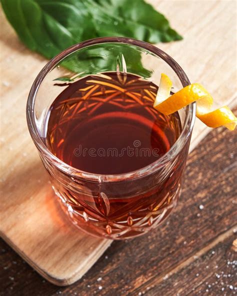 Old Fashioned Rum Drink with Orange Garnish Stock Photo - Image of liquid, shot: 260125478