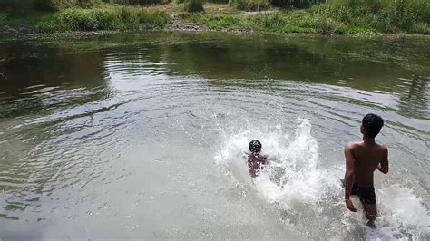 Children bathing in river - YouTube