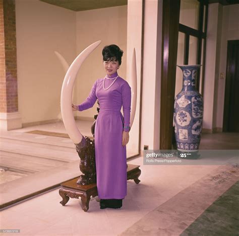 Former First Lady of South Vietnam, Madame Nhu posed standing next to... | Madame nhu, First ...