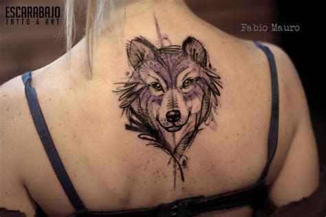 Sketch work style wolf tattoo on the upper back.