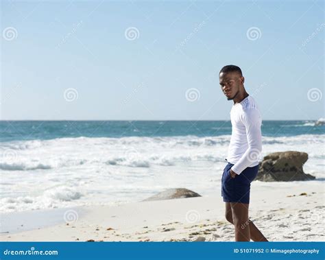 Handsome Young Man Standing Alone at the Beach Stock Photo - Image of confidence, confident ...