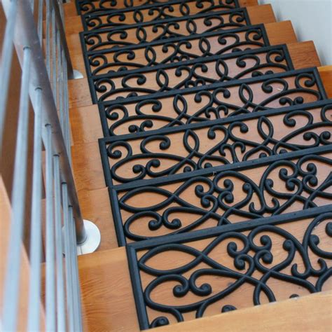 the stair treads are made from wood and wrought iron