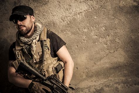 Portrait Of Modern Mercenary Soldier Looking Worried With Assault Rifle ...