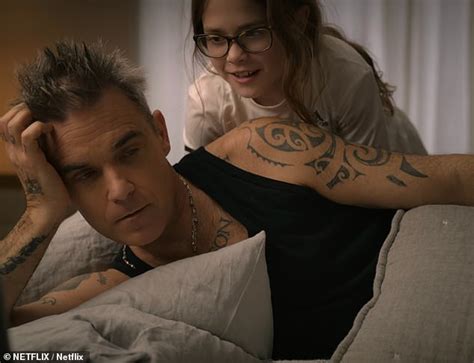 Robbie Williams' daughter Teddy, 11, has an adorable reaction to seeing old footage of him on ...