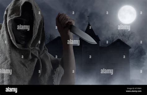 Scary bizarre man holding knife hi-res stock photography and images - Alamy