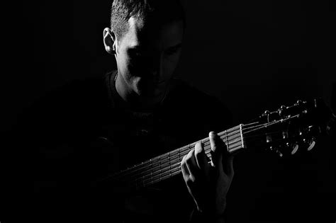 Royalty-Free photo: Grayscale photography of man playing guitar | PickPik