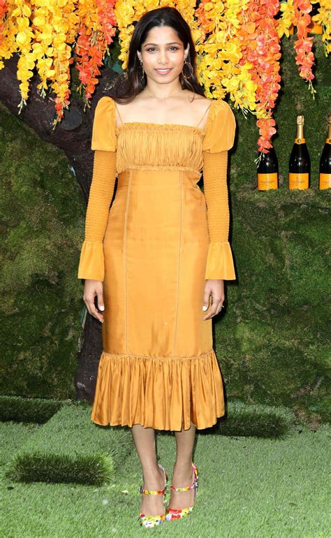Freida Pinto in a mustard long sleeved midi dress Red Carpet Outfits ...