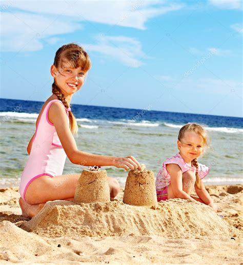Children playing on beach. — Stock Photo © poznyakov #6335593